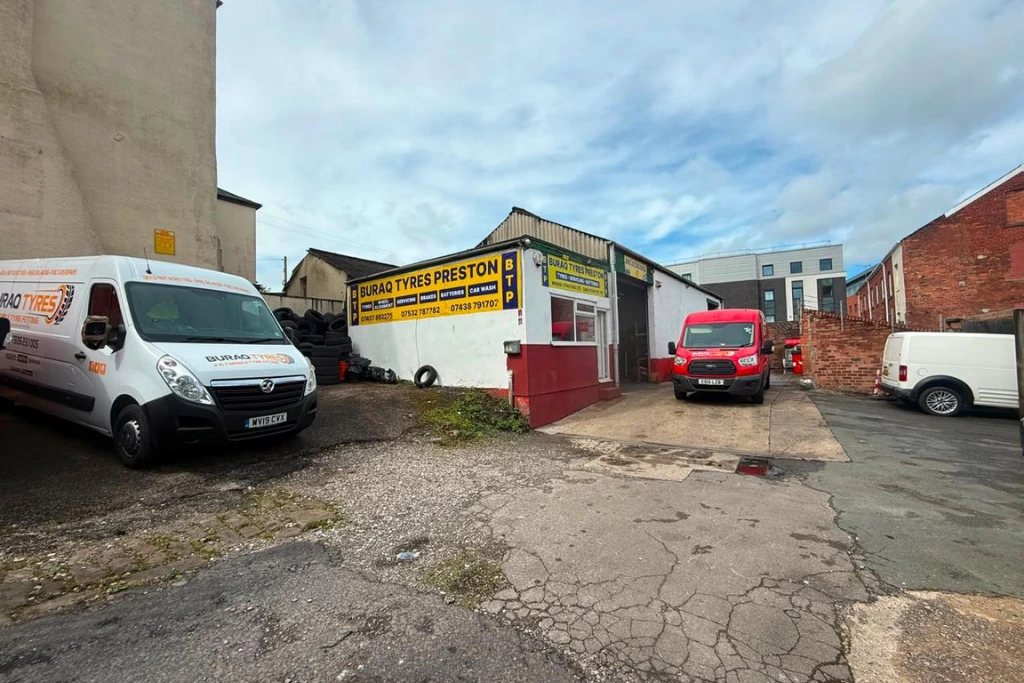 Buraq Tyres Preston garage exterior with vans parked outside