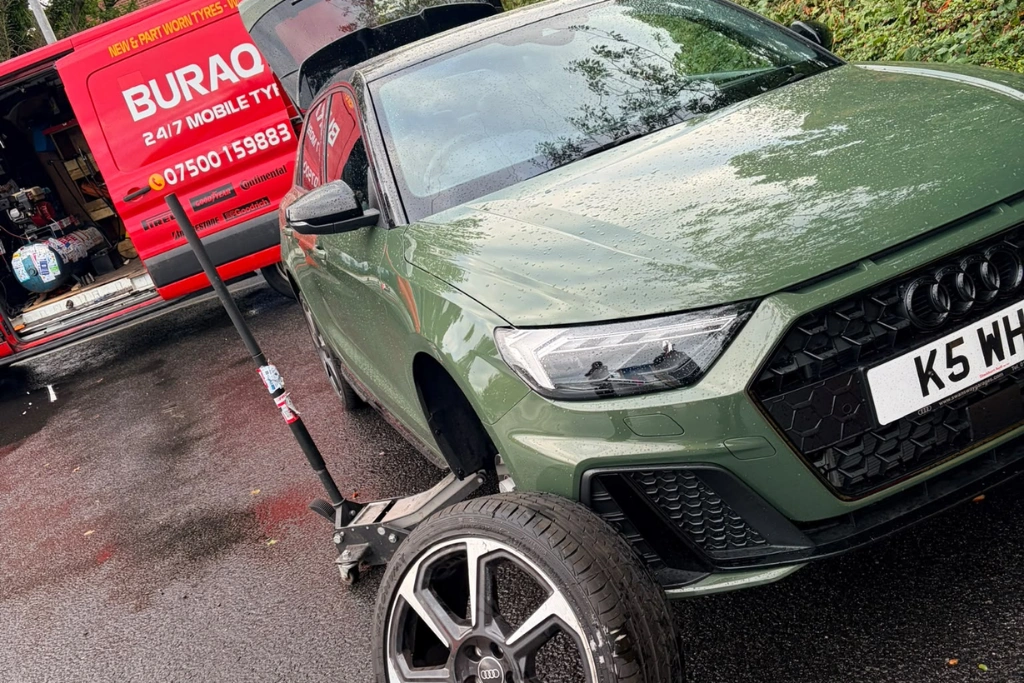 Buraq Tyres van fitting tyre on green Audi A1 in Fleetwood