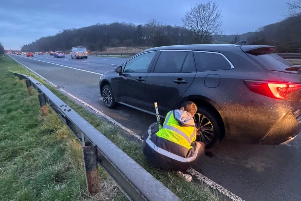 Emergency mobile tyre fitting on motorway hard shoulder, Garstang