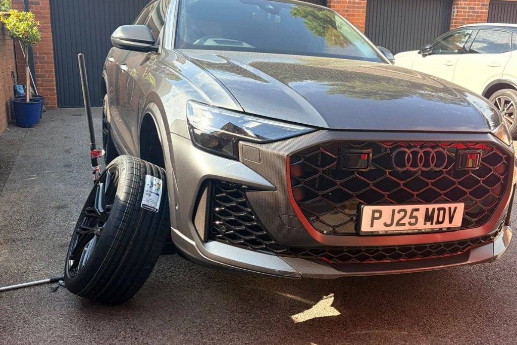 Mobile tyre fitting on grey Audi Q8 in Lanchester driveway